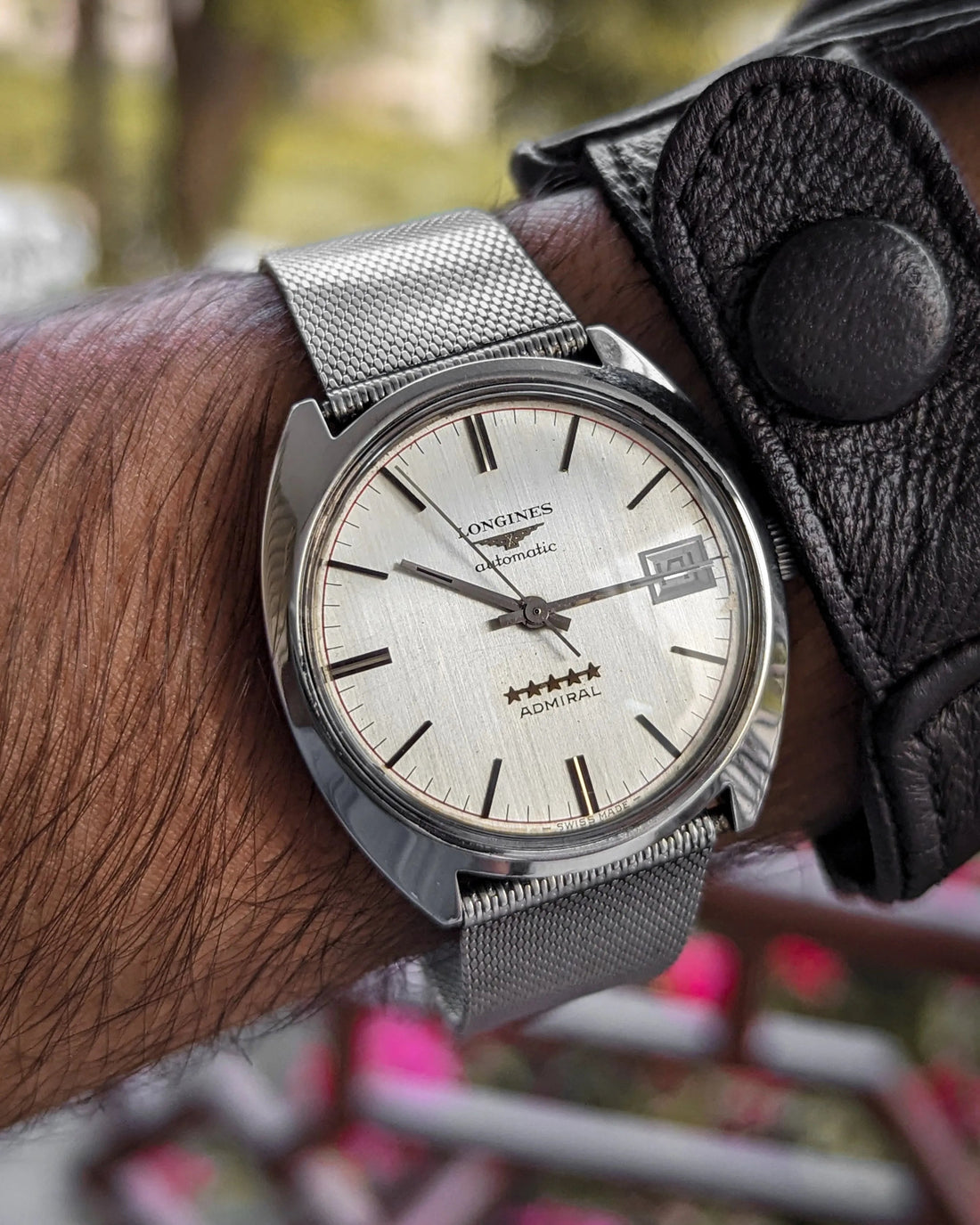 vintage silver automatic wristwatch with mesh strap, five-star Admiral dial, on wrist